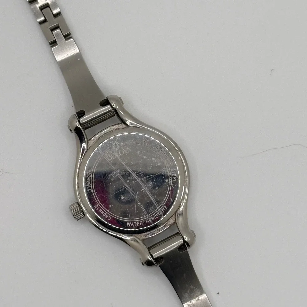 Bulova‎ Women Silver Tone Crystal Bezel White Dial Bangle Watch C869915 READ